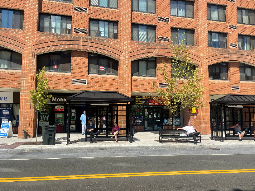 people sitting at bus stations