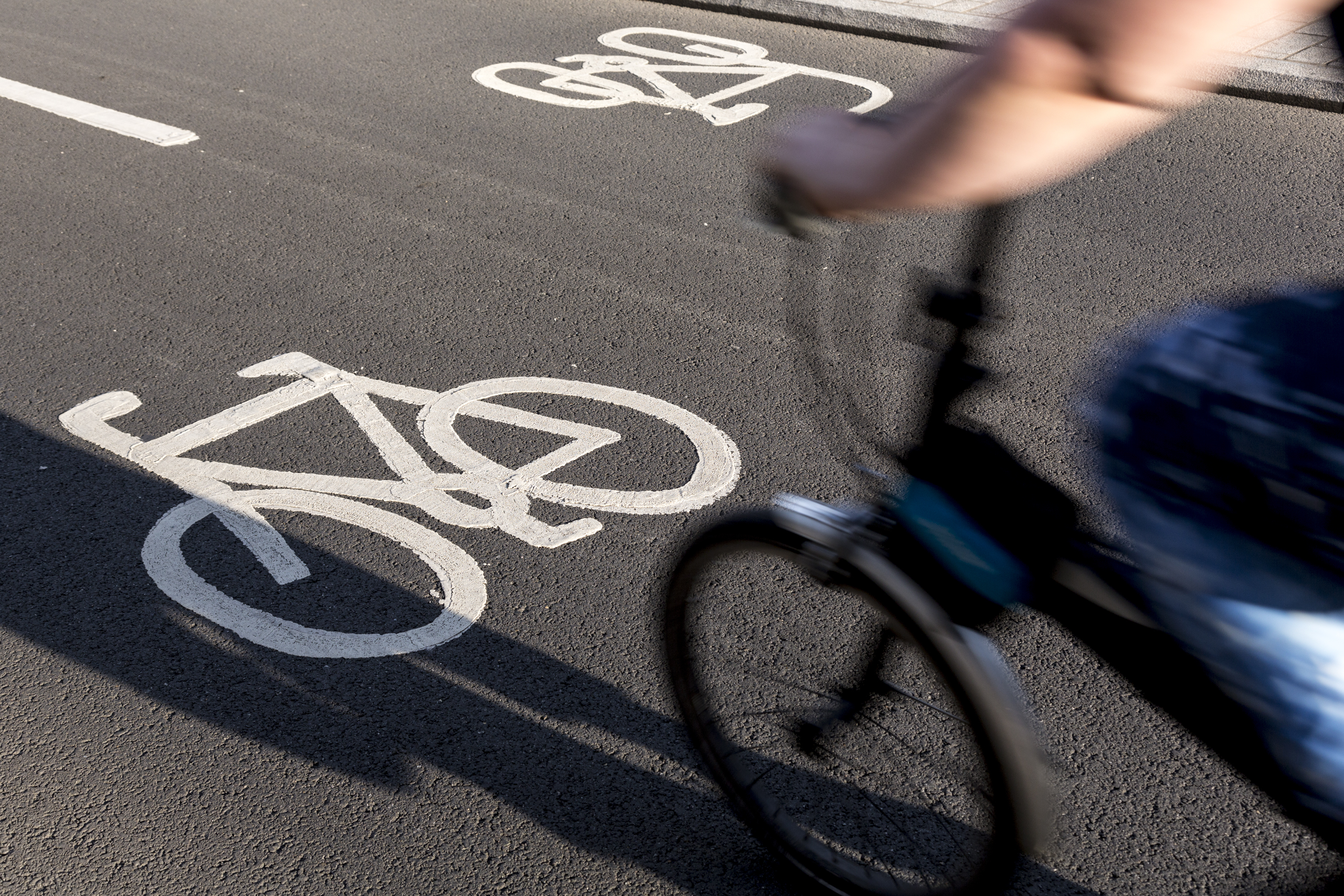 a bike path symbol on the road